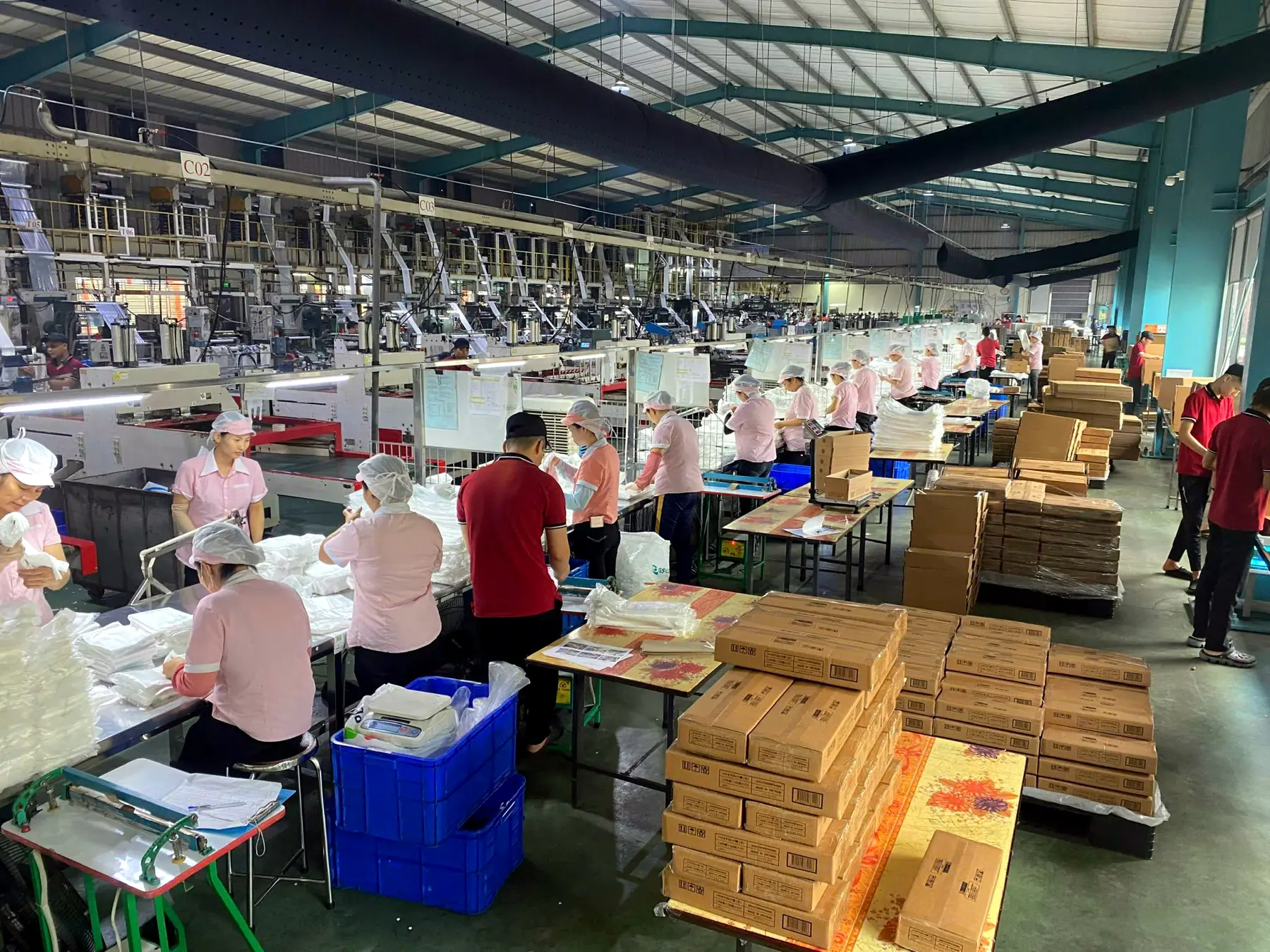Inspection and counting tables with finished bags and cartons