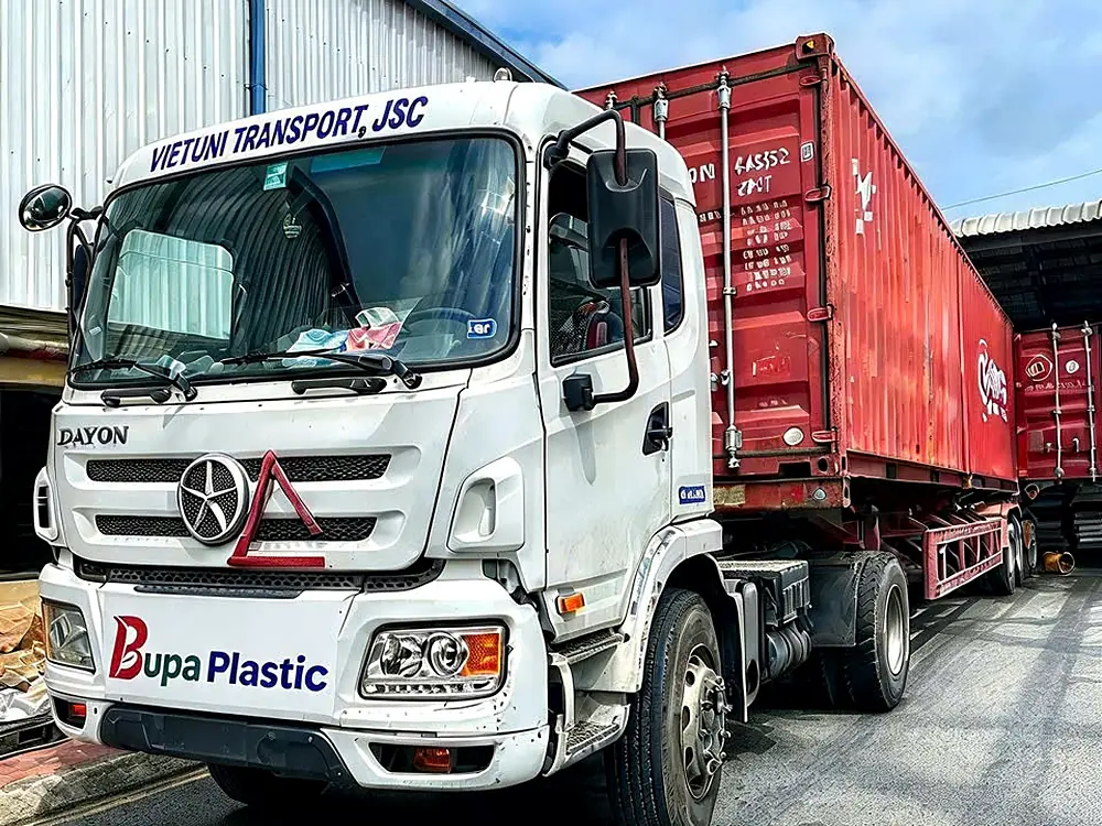 Bupa Plastic truck hauling an export container